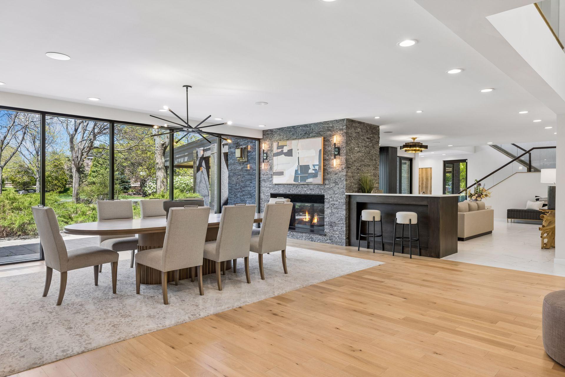 The main level features a chef-inspired kitchen, formal and informal entertaining spaces, dining room, new home theater, main floor laundry and guest suite.