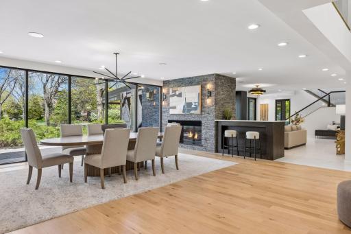 The main level features a chef-inspired kitchen, formal and informal entertaining spaces, dining room, new home theater, main floor laundry and guest suite.