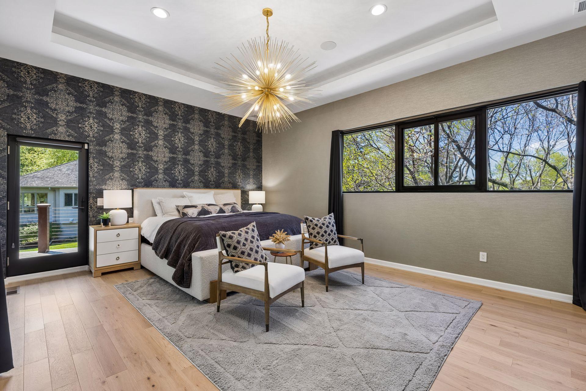 Upstairs, the luxurious primary suite offers a spa-like bathroom and private balcony retreat.