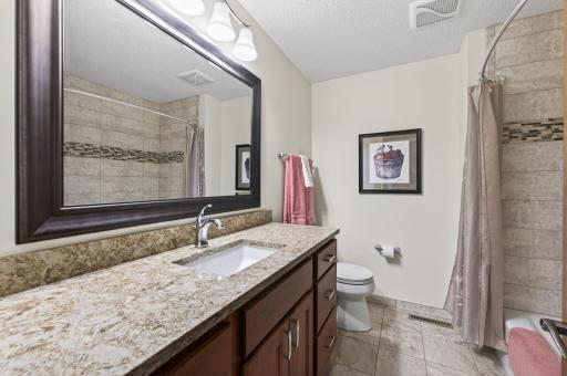 Second upper bathroom, updated with Cambria countertops and tiled bathtub