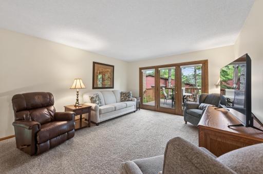 Upstairs living room leading to deck