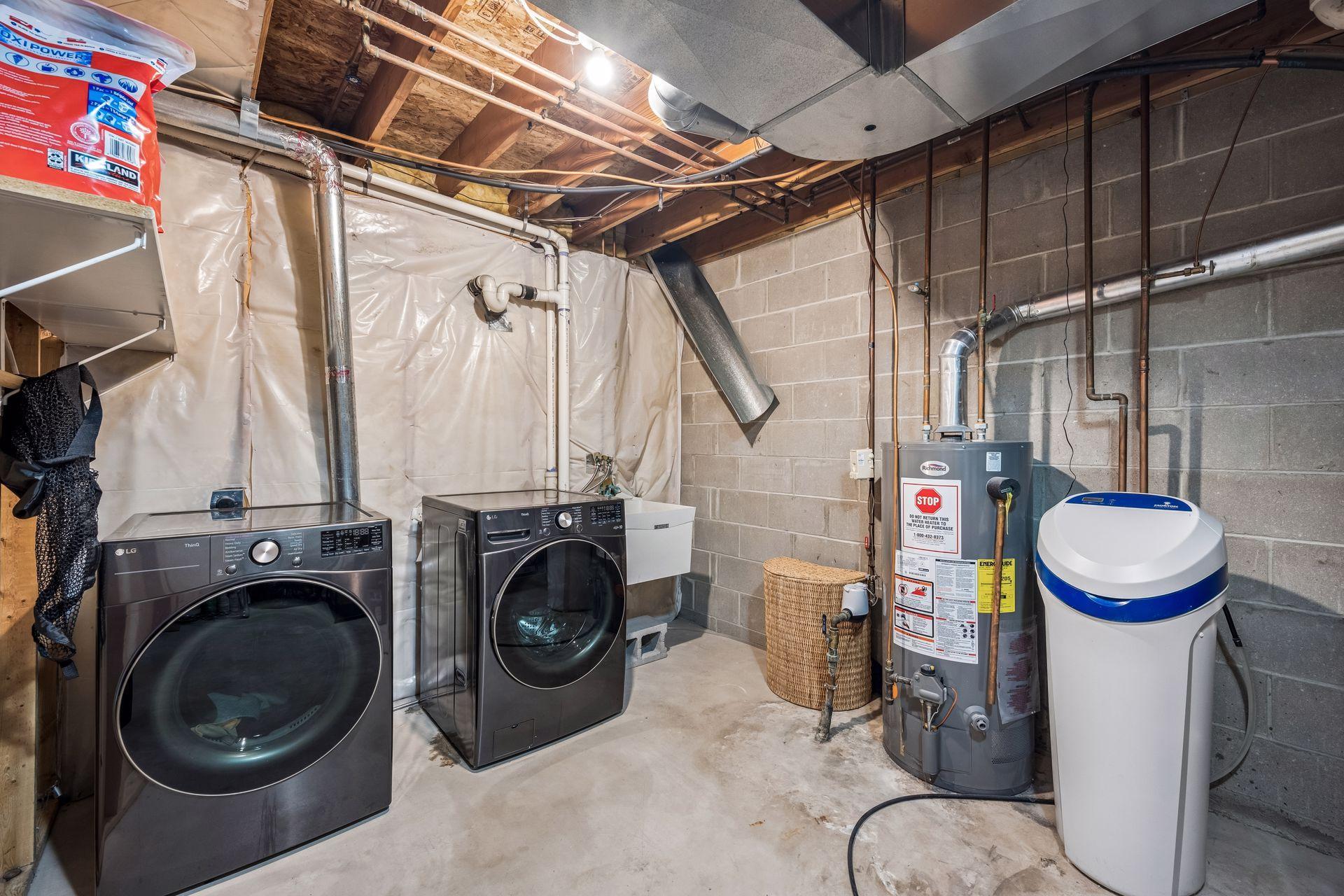 Laundry room with updated water heater and softner 2021 and furnace in 2019.jpg