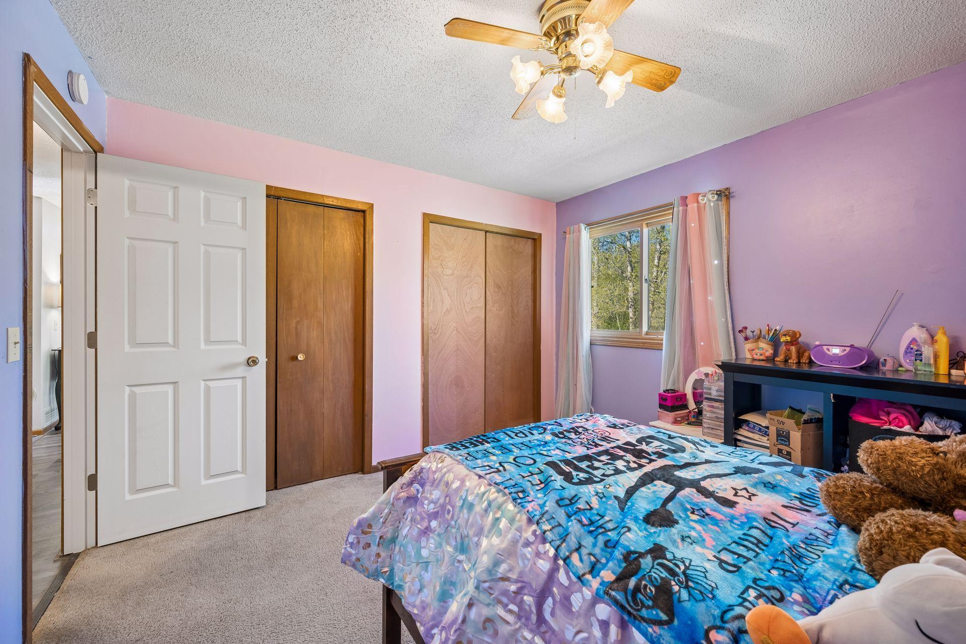 Another view of the upper level bedroom with dual closets