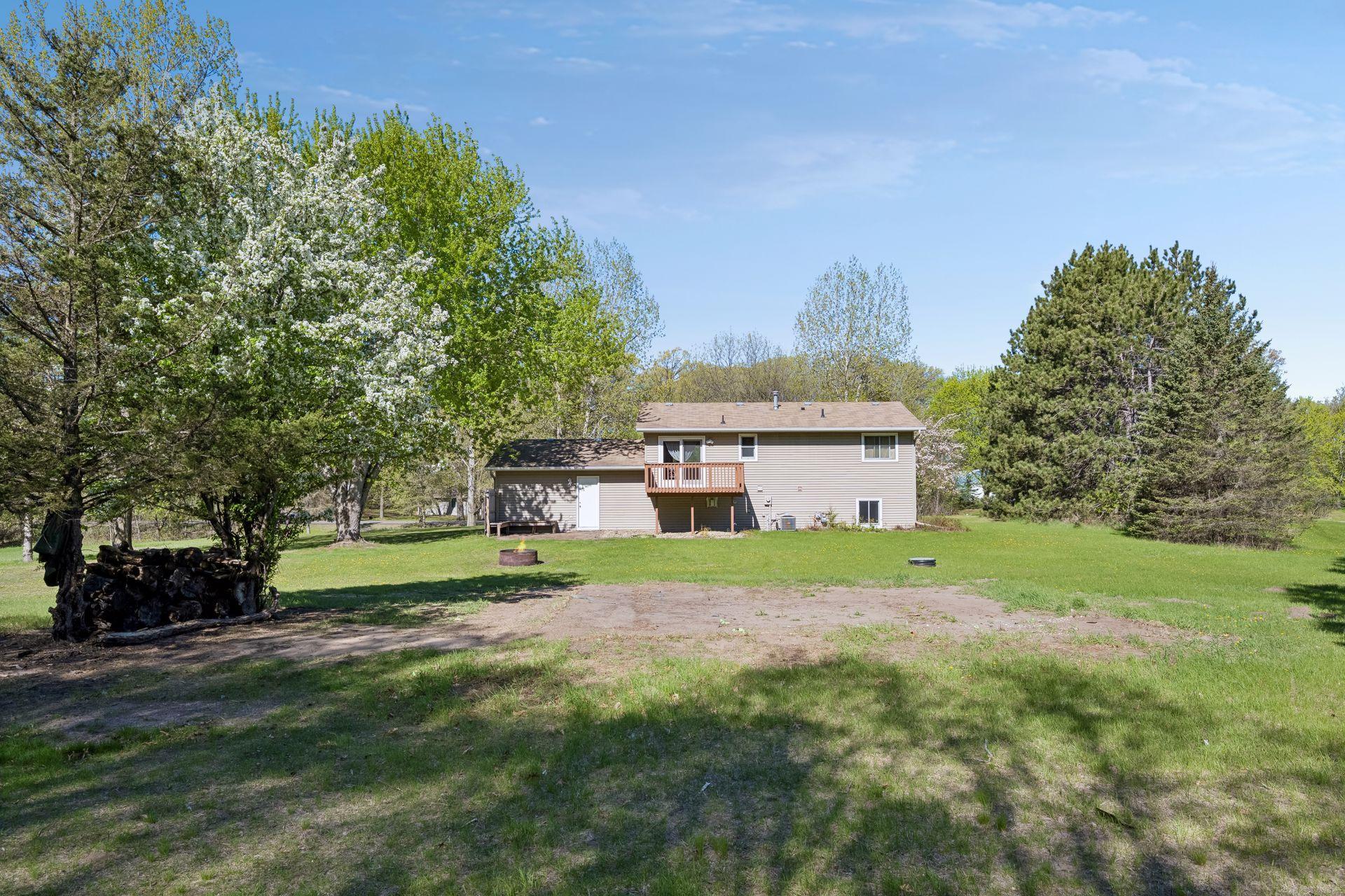 Nice mature trees adorn the acreage lot