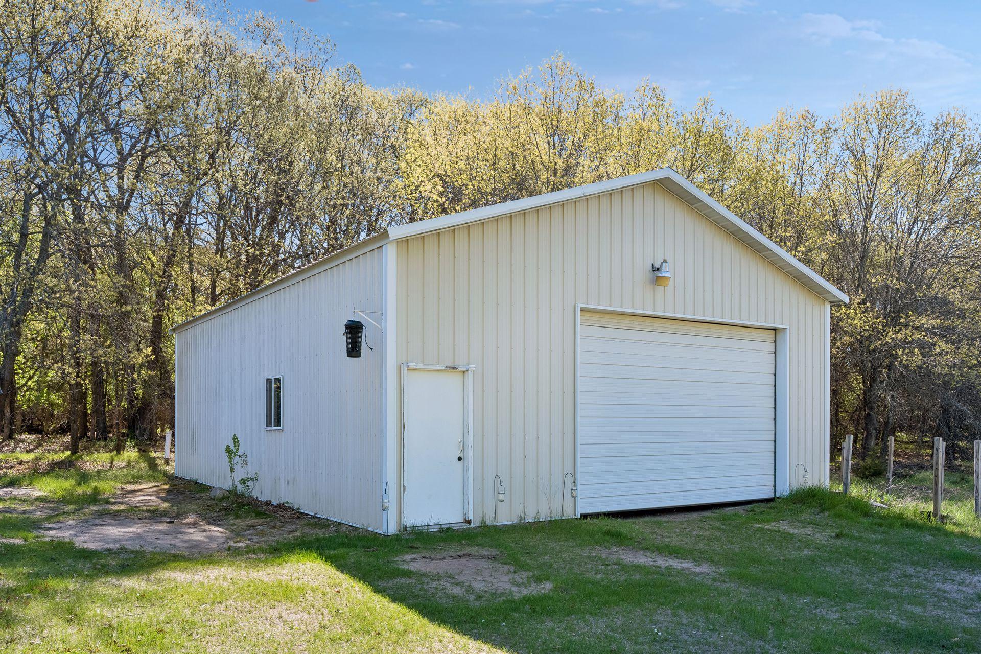 30x40 pole building with electric and large overhead door.