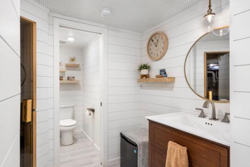 The bathroom offers a spacious walk-in tile shower, heated floors, and a separate water closet, creating a wonderful retreat.