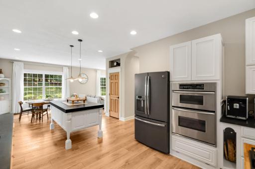 An alternate view of the kitchen showcasing the nearby dining room.