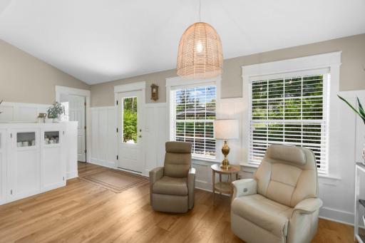 Another look from the sitting room showcasing access to the patio and main-level office space.