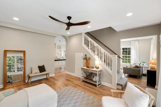 Step inside to a light-filled, open-concept main level with beautiful seamless flooring flowing throughout.