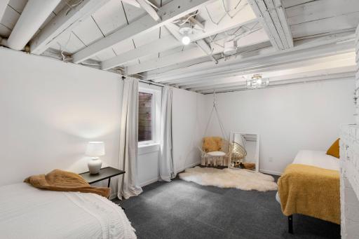 The lower level adds even more living space with a fifth bedroom featuring carpeting and an egress window.