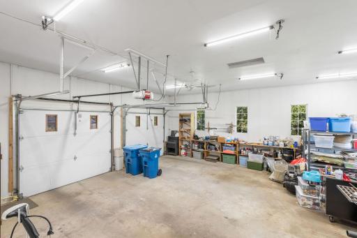 The attached garage is insulated and equipped with a mini-split system for both heating and cooling, offering year-round comfort.