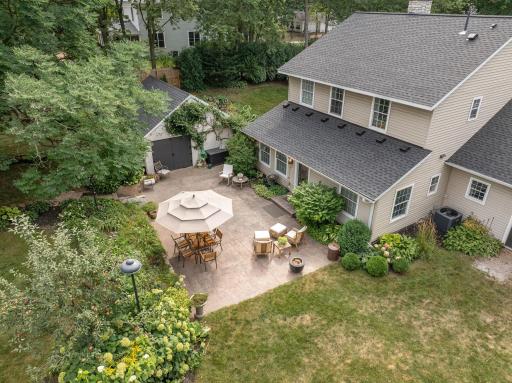 An aerial perspective of the spacious patio and private backyard.