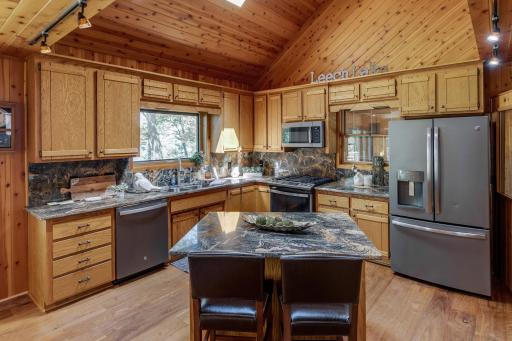 Kitchen view with island and breakfast area.