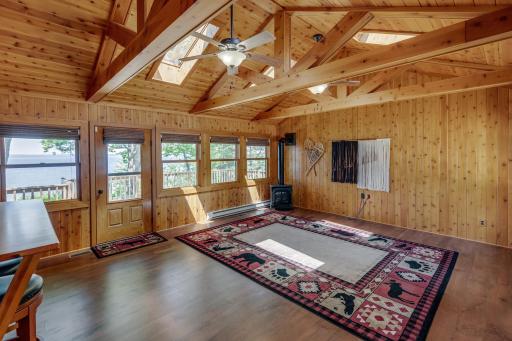 Large Four season porch/sun room with fireplace.