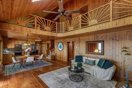 Family room view of loft and vaulted ceilings.