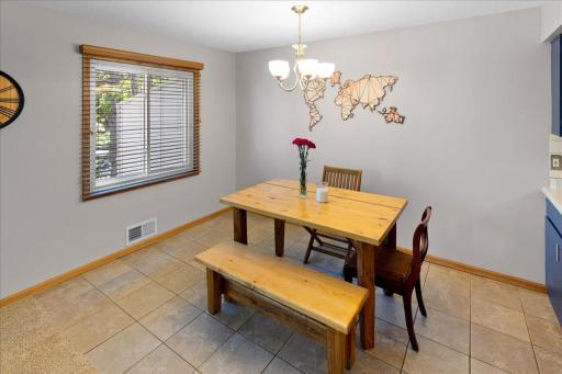 Tile floors in the dining area and kitchen make clean up a breeze.