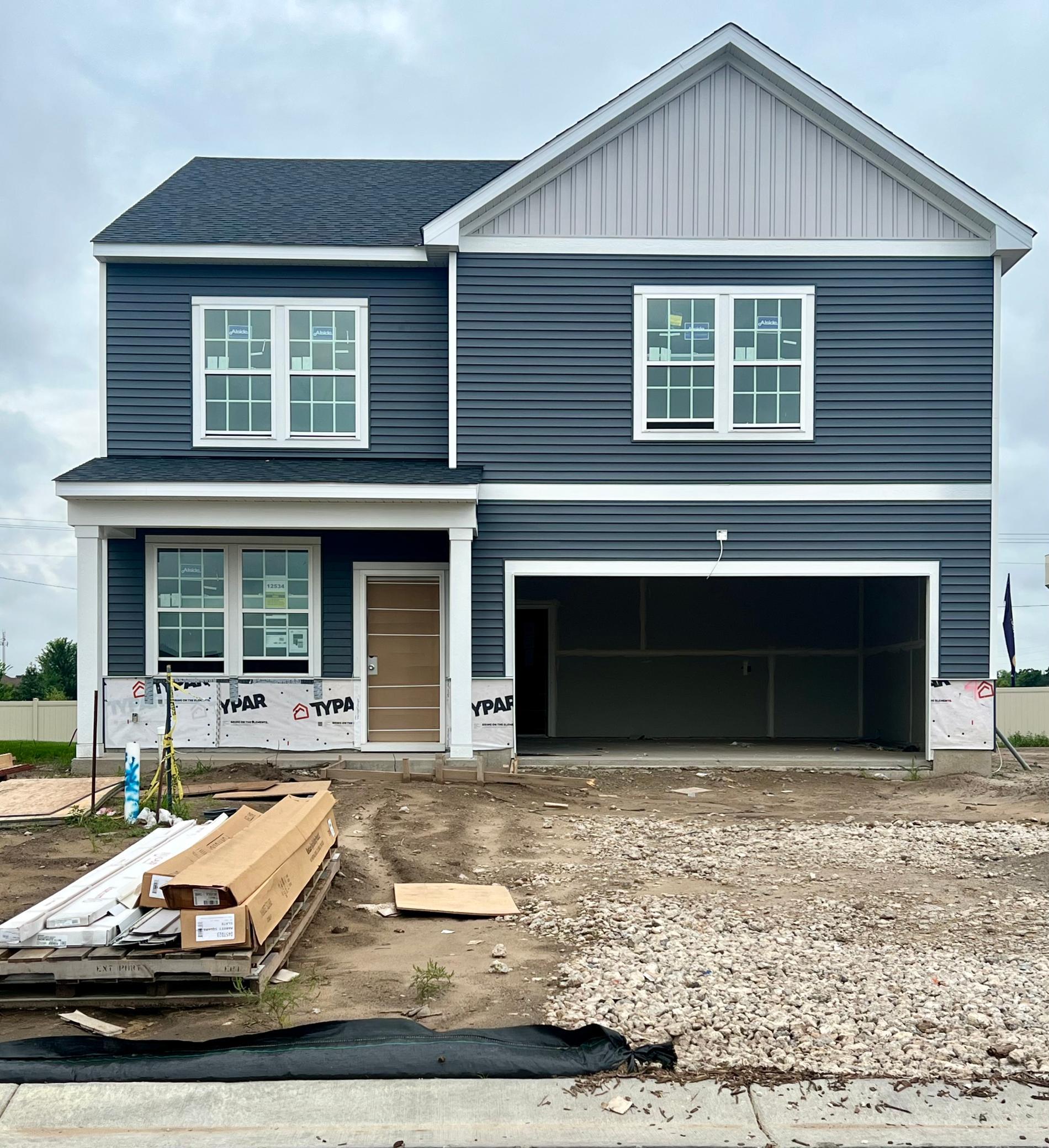 Striking curb appeal with clean lines and modern Heartland architectural design.