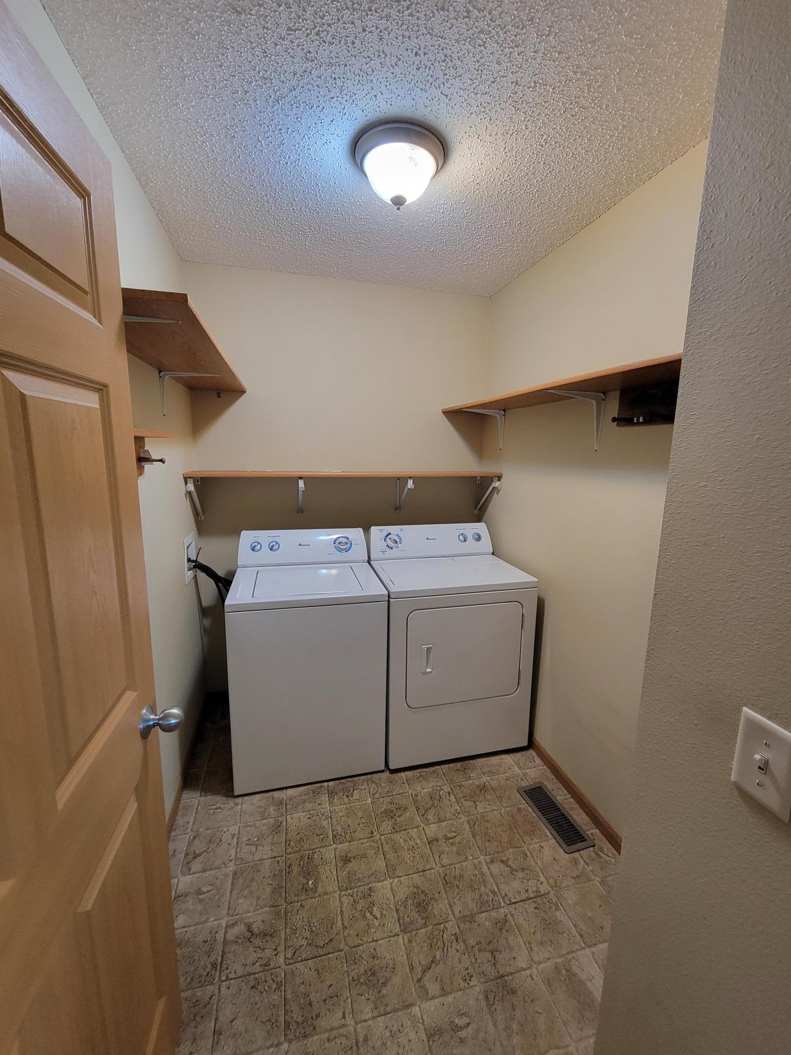 Laundry room with extra shelving