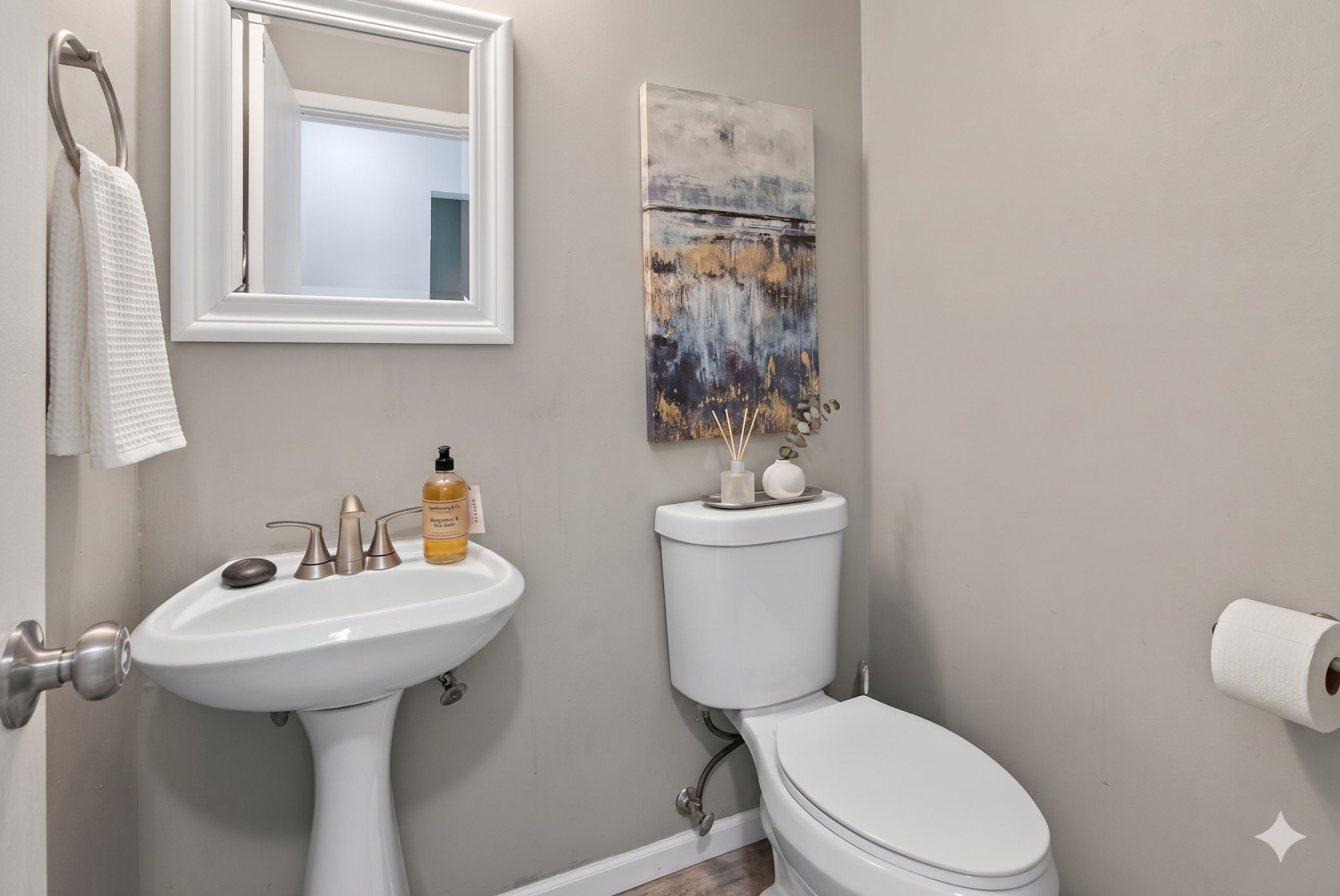 Main level: 1/2 bathroom (virtually staged)