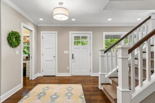 Your view as you walk to your front door to greet guests. Open and spacious with front closet. All doors throughout are solid core and paneled. NEW stair runner has been ordered and will be installed shortly.