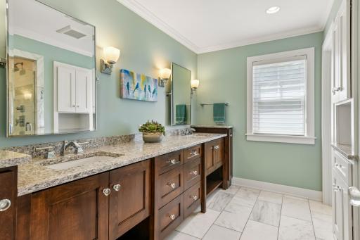 Buyers will love the primary bath with dual vanity, marble tile floors, separate stool area and walk in shower.