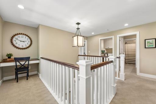 Another view of upper loft and study nook. Views into full bathroom and laundry room.