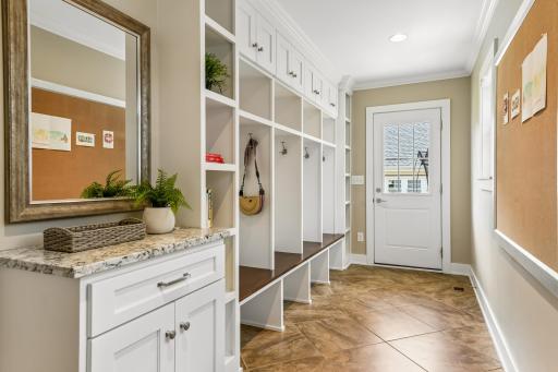 Ideal back entrance with tile flooring, cubbies for storage and drop zone for keys, phones and all items in our daily lives.