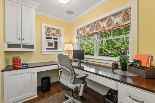 Cheerful front office as you enter the home is ideal for work, daily tasks and more! Built in deck and cabinetry to stay organized.