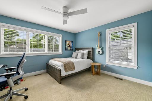 Spacious uUpper bedroom with view of backyard.