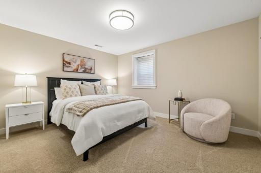 Inviting 4th bedroom in the lower level offers space and simply timeless design for all to feel welcome as a guest.