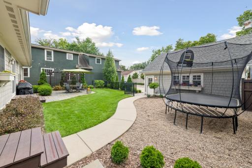 Two separate entrances to the backyard. One off the eating area and one off the back cubby area. Peet rock currently for play area but easy to add more grass if buyer desires.