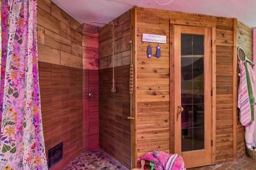 New Finnleo (traditional Finnish wet/dry with stones for steam) sauna and shower next to the exercise space in the lower level.