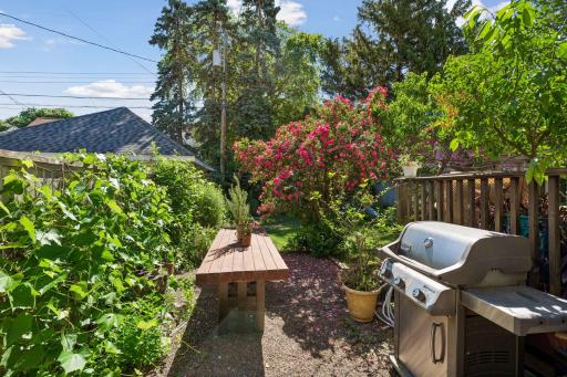 Separate grilling and garden space next to the deck.
