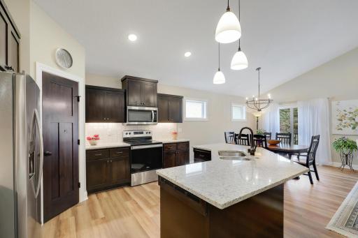 Large center island offers a wonderful workspace for meal prep