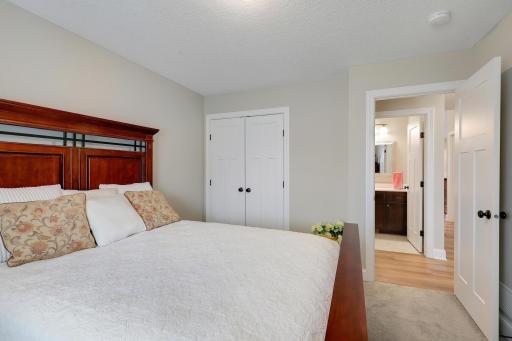 Spacious double closet with French doors and a full bath just across the hall