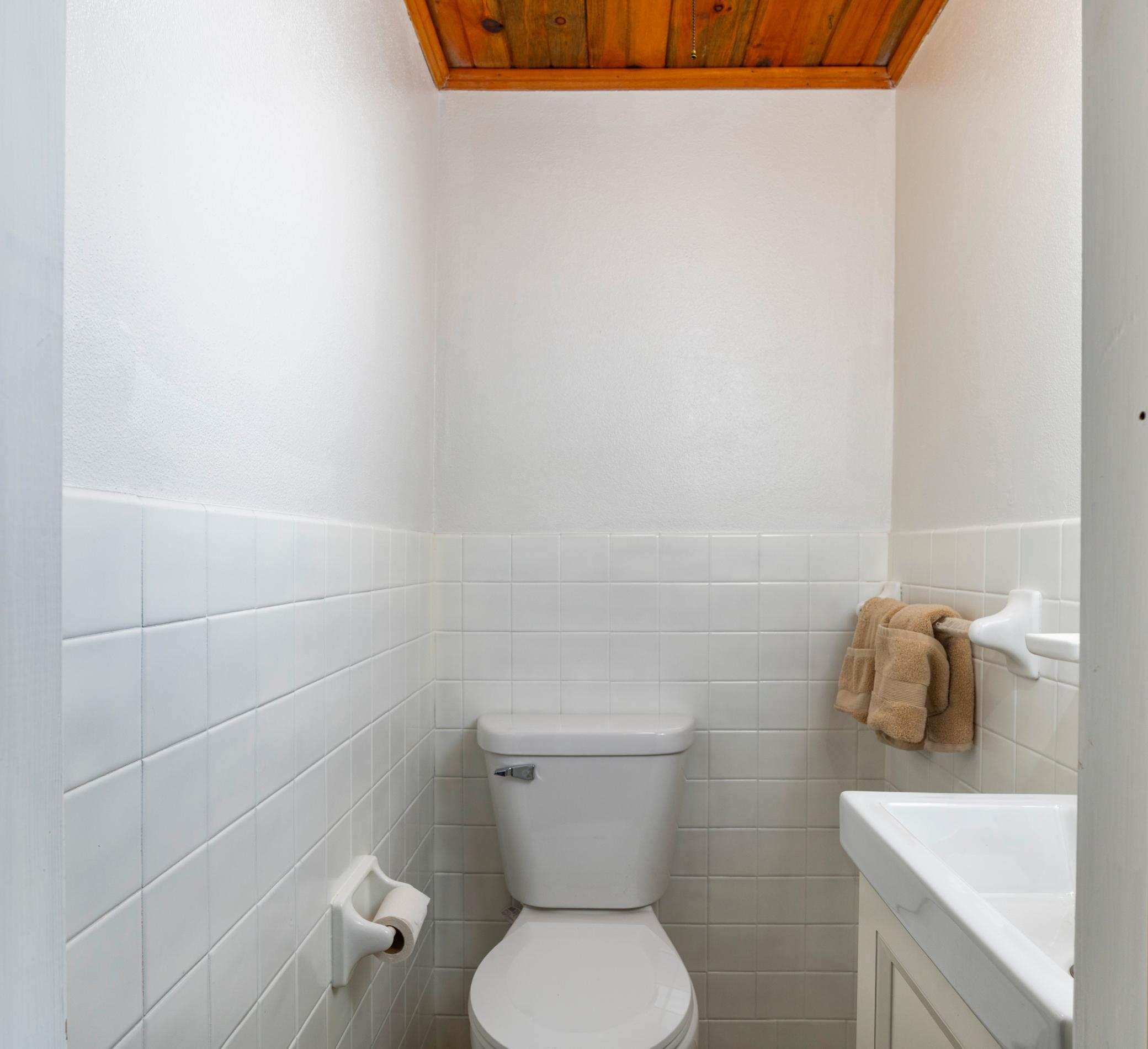 Convenient half bathroom in the lower level.