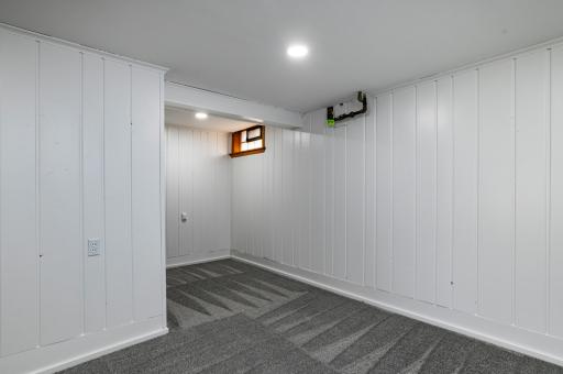 One of the large bonus rooms in the lower level, could easily become additional legal bedrooms by adding an egress window.