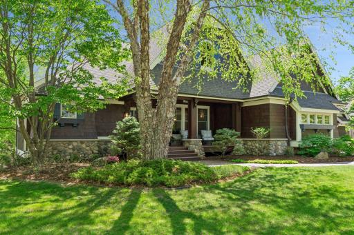 This 4-bedroom, including a primary suite on the main level and 4 bathroom home has amazing curb appeal on a private, wooded lot.