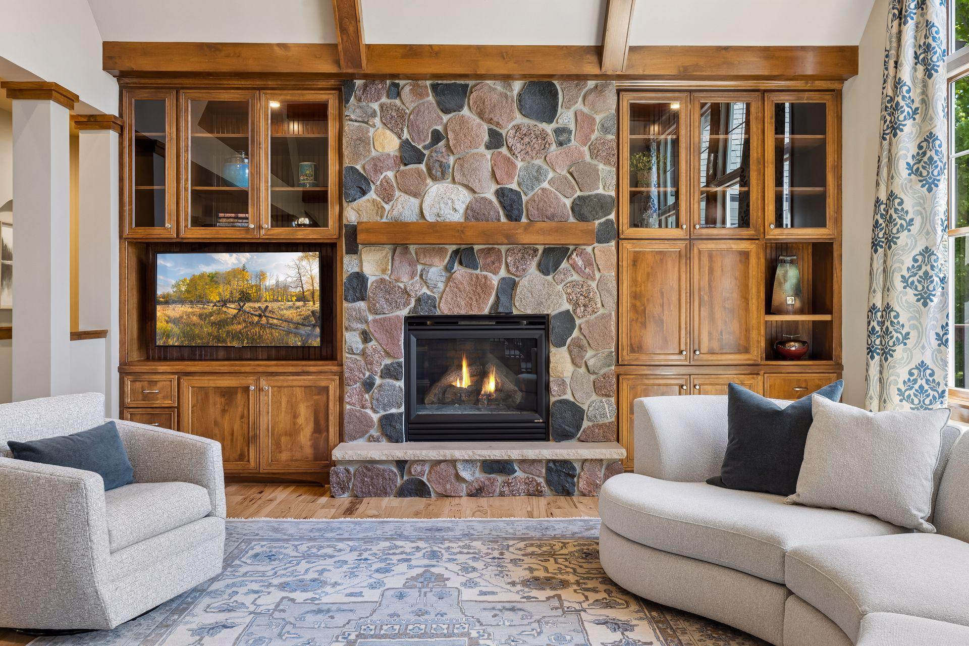 Built-in cabinets and shelves for your storage and display. Stone gas fireplace checked & cleaned May, 2026.