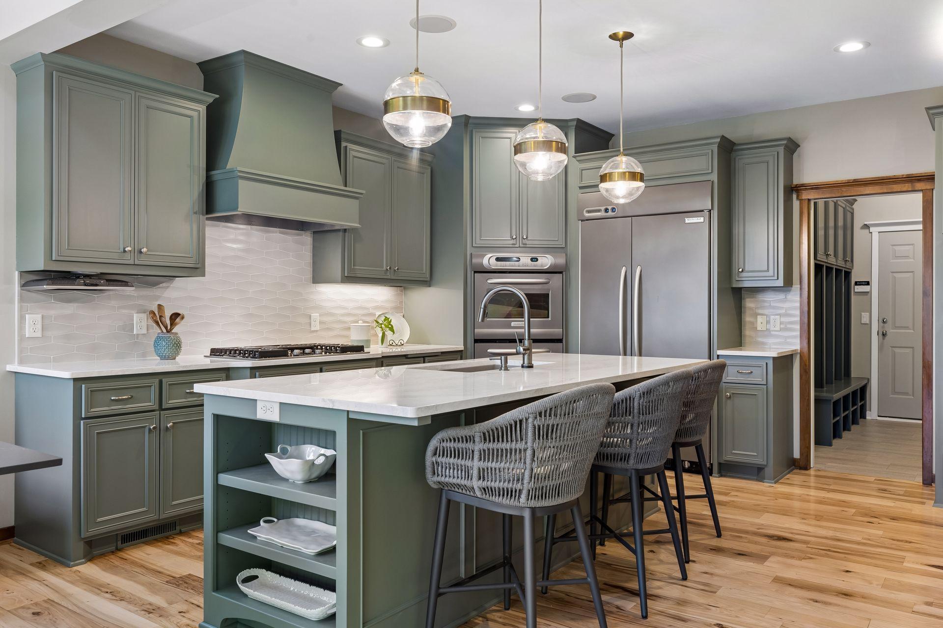 The spacious, well-equipped kitchen is a chef's delight! Features quartz countertops & a large island w/a deep double sink, a touchless faucet, & a disposal. Abundant cabinet storage w/pull-out shelves in the lower cabinets & soft-close drawers.