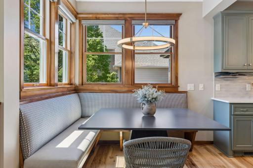 Plenty of informal seating at the island & the corner banquette surrounded by windows. The ceiling in the dining area is vaulted giving it a bright, open feel.