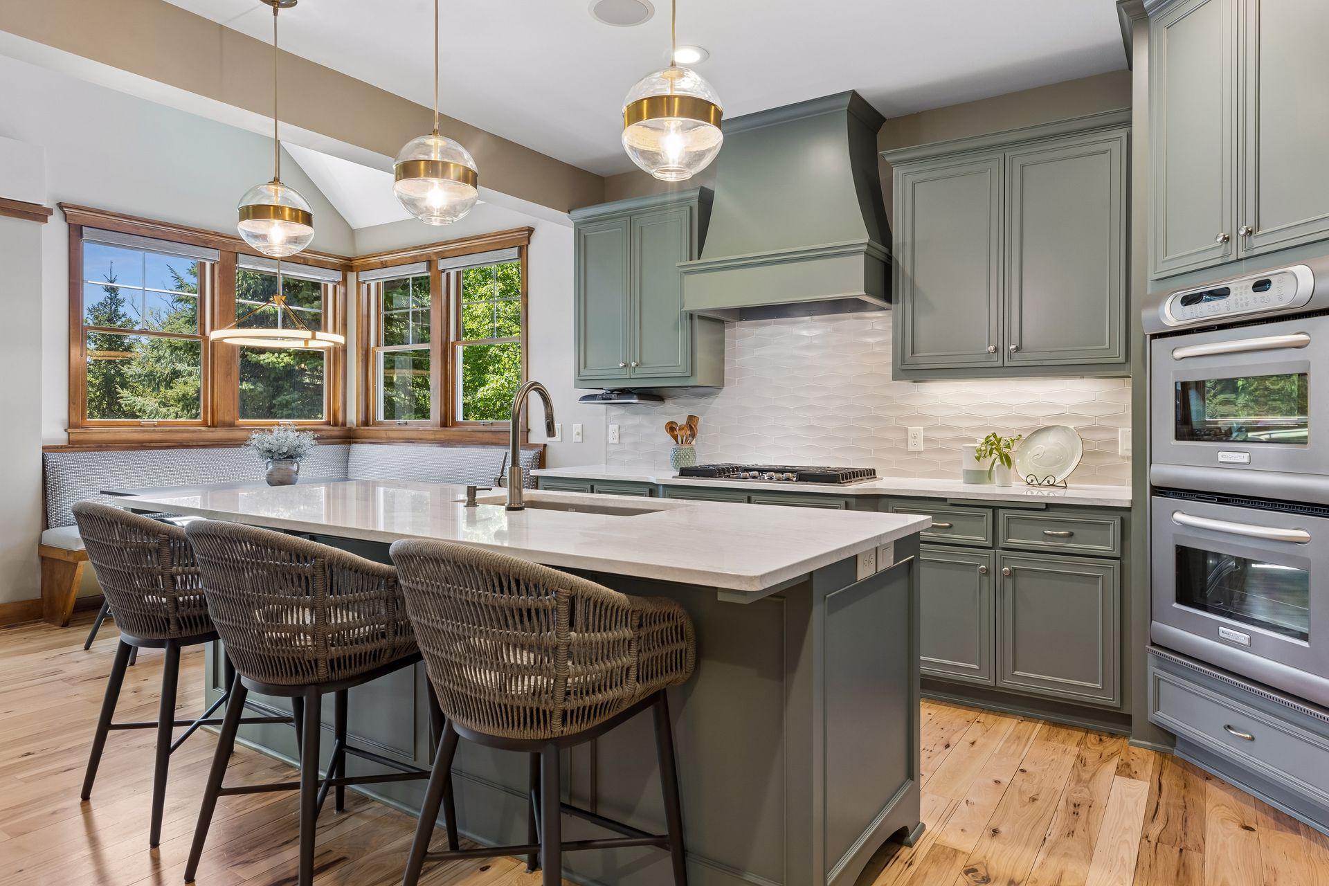The kitchen is equipped with KitchenAid Proline series refrigerator, double oven & 5 -burner gas cooktop with a Vent-a-Hood. There is also a Marvel wine refrigerator, Miele dishwasher & a Whirlpool microwave.