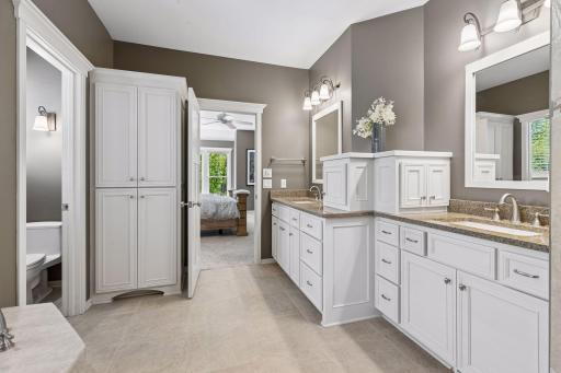 This view highlights all the storage included in the comfort-height vanity and the double linen closet.