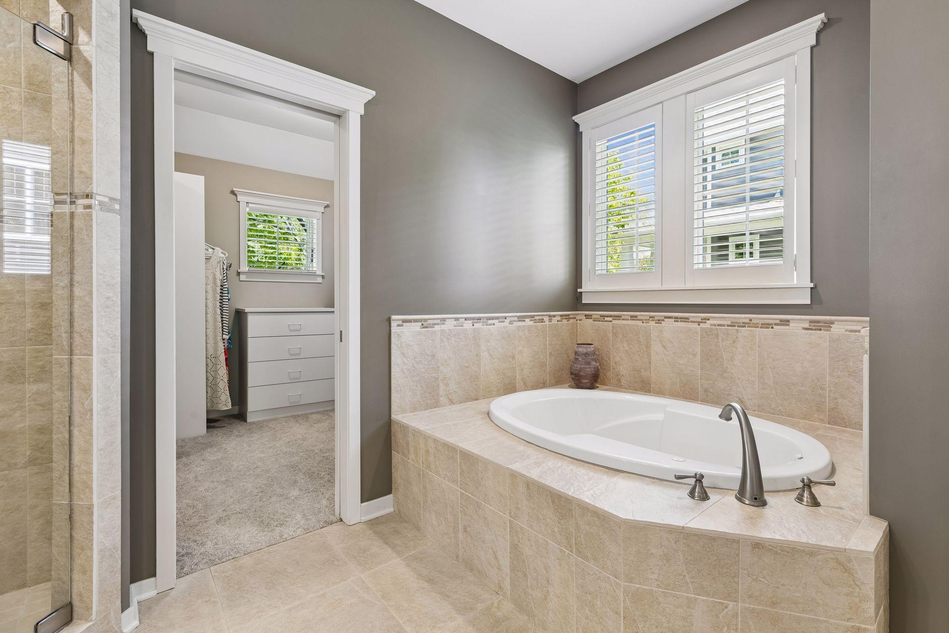 Another view of the bright, spa-like private primary bathroom.