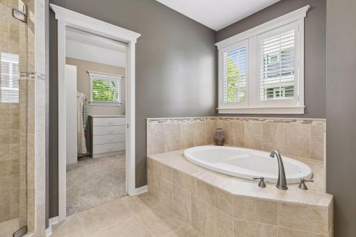 Another view of the bright, spa-like private primary bathroom.