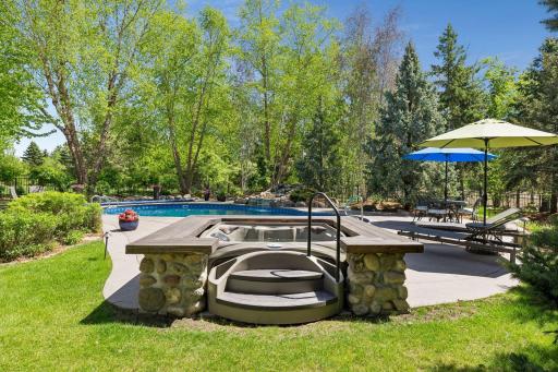 The newer built-in hot tub (2022) holds 4-6 people. It adds to the resort-like feel of the backyard oasis.