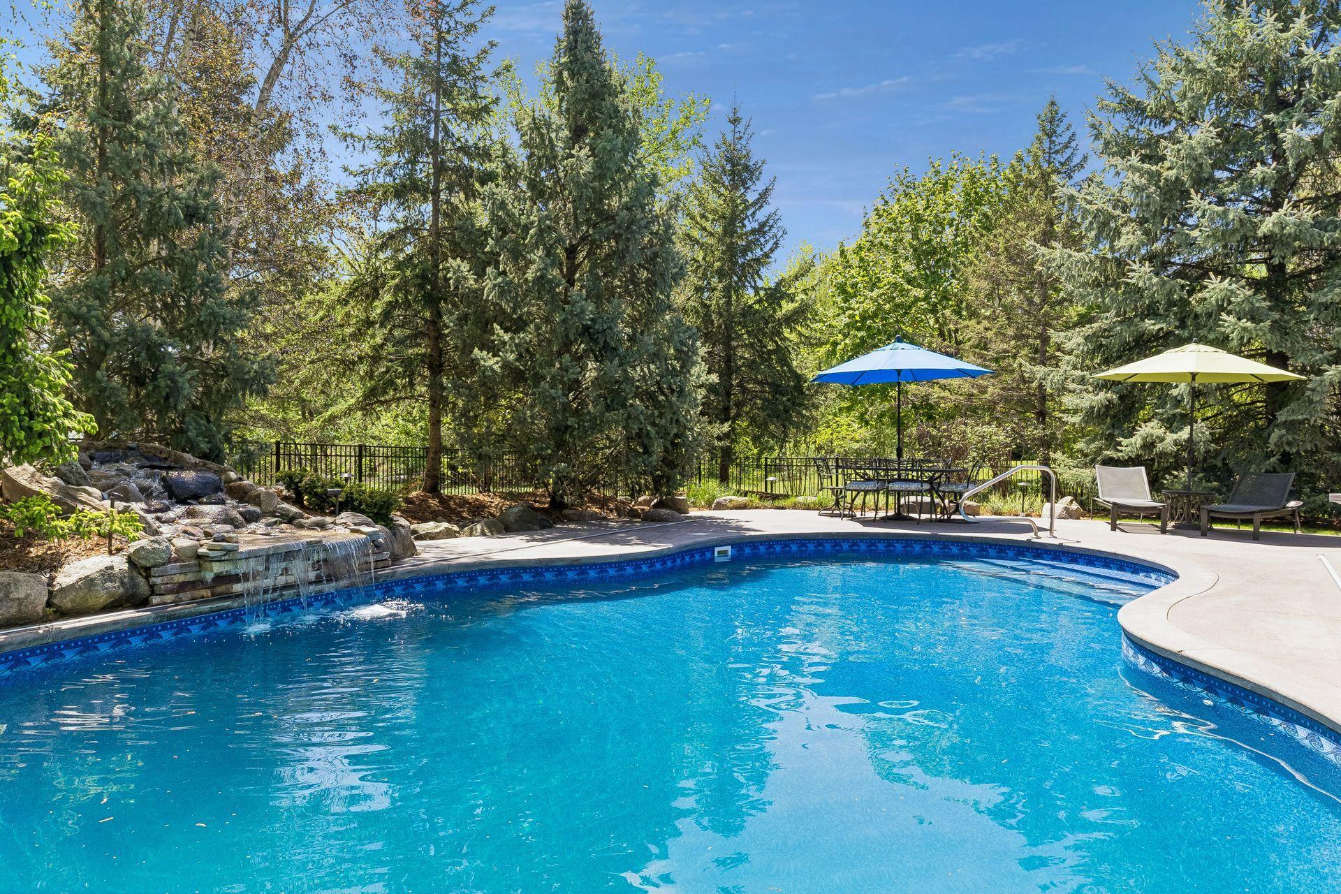 Another view of the pool & waterfall feature. Enjoy many sunny days in your own resort-like backyard.