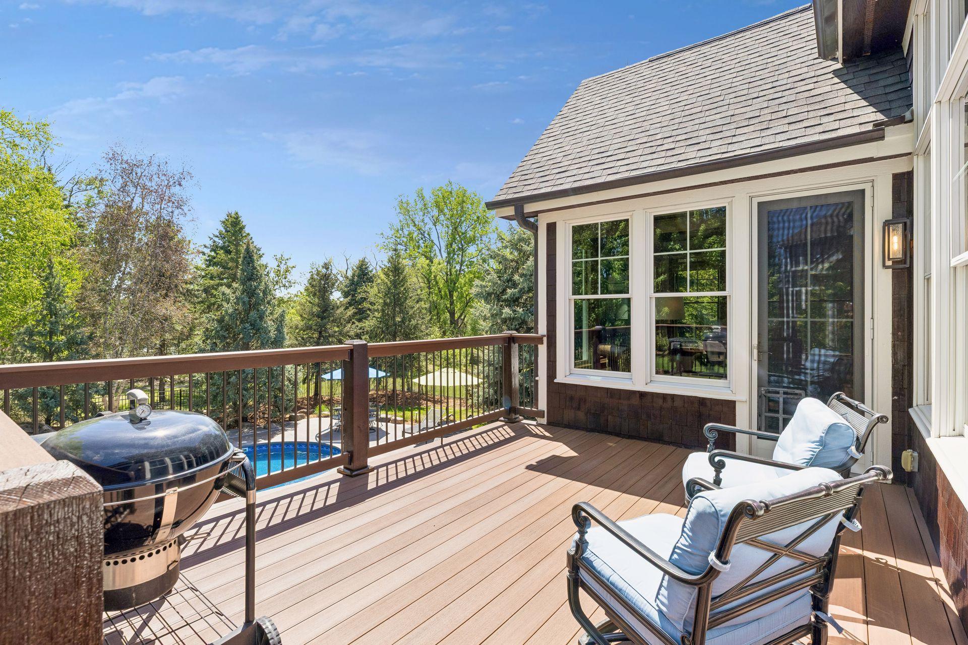 Just off the sunroom is a spacious new TimberTech (2025) maintenance-free deck (15' x 11'9") that overlooks the resort-like backyard. Its location near the kitchen is perfect for grilling.