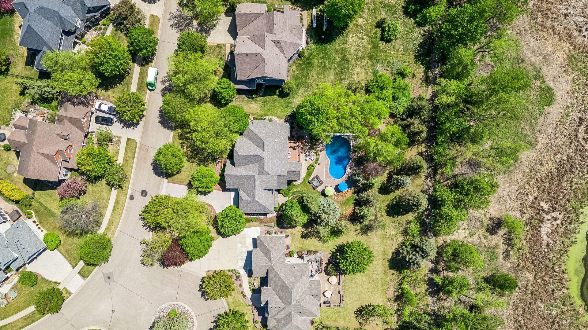 Aerial view of the home's location in the Dancing Waters community. It's located just off a cul-de-sac & backs up to a walking path & Fish Lake & wetlands.