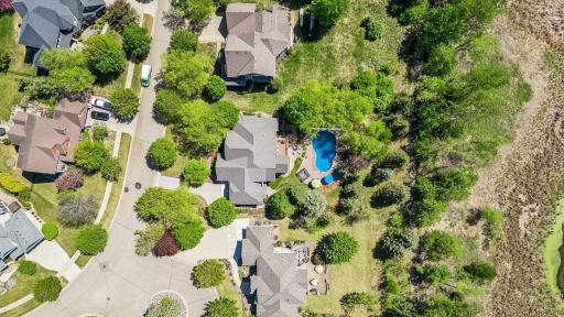 Aerial view of the home's location in the Dancing Waters community. It's located just off a cul-de-sac & backs up to a walking path & Fish Lake & wetlands.